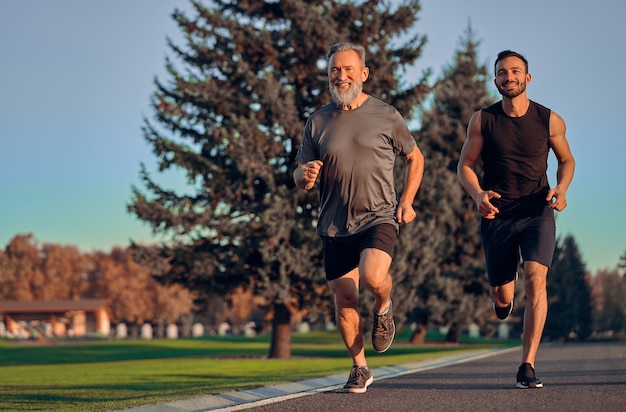 The happy father and son running on the road