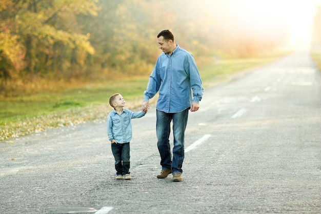 Happy father and son walk in nature