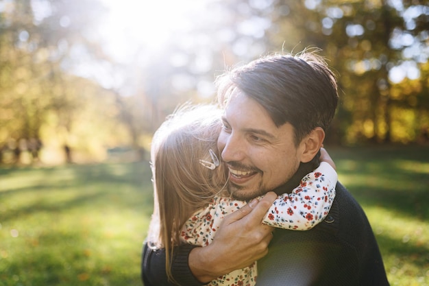 Happy father with little daughter in autumn park outdoor recreation Father and daughter