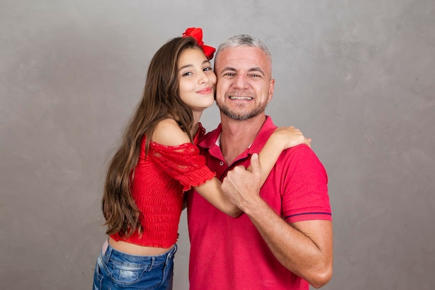 Happy Fathers Day Happy caucasian father and daughter hugging on plain background with copy space