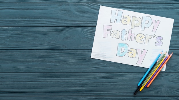 Happy Fathers Day inscription with pencils