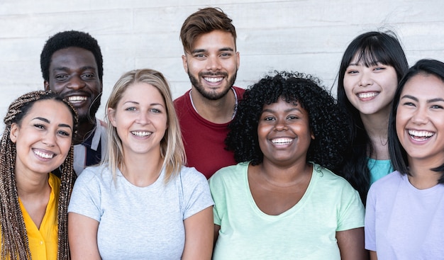 Happy friends from different races and culture laughing