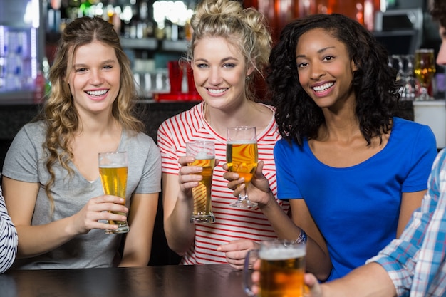 Happy friends having a drink