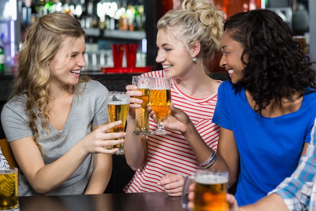 Happy friends having a drink