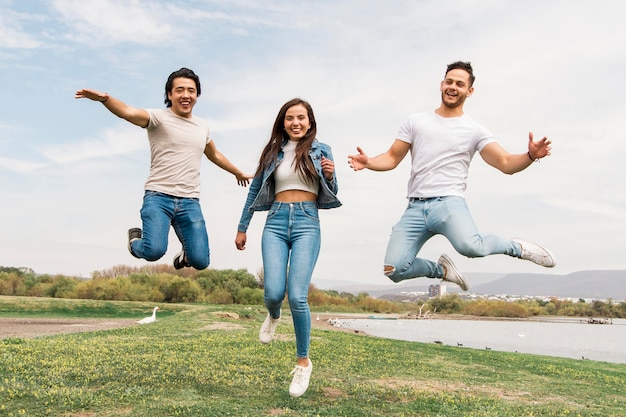 Happy friends jumping