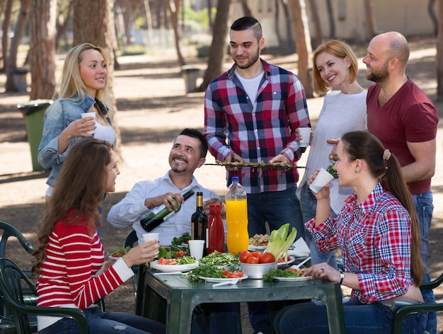 Happy friends making grill &#xA;