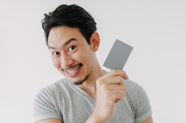 Happy funny face man show off his empty card on white background