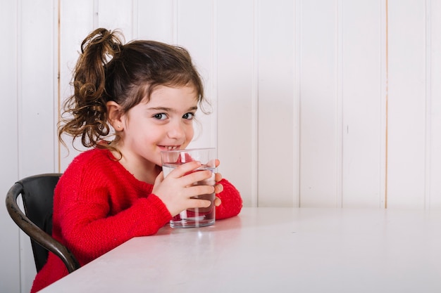 Happy girl drinking water