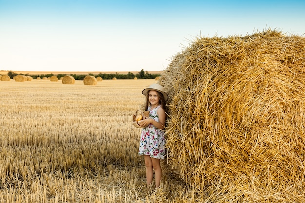 Happy girl on field of wheat