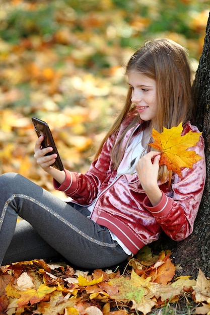 Happy girl is doing selfie using a smartphone