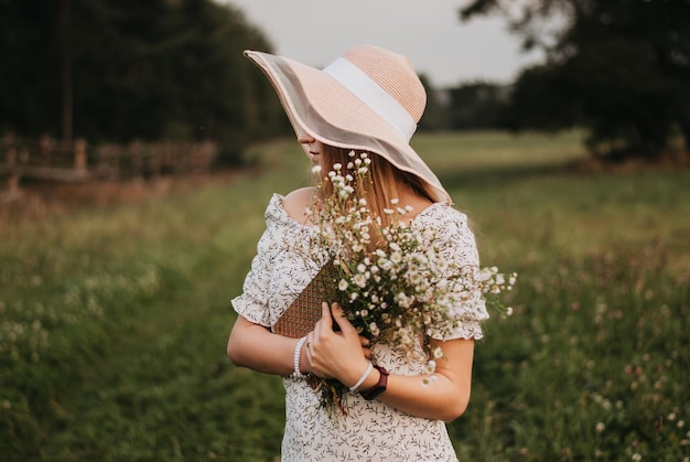 Happy girl Long hair White dress A hat with a brim