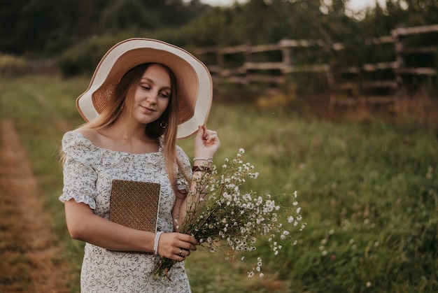 Happy girl Long hair White dress A hat with a brim