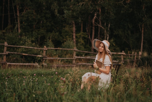 Happy girl Long hair White dress A hat with a brim