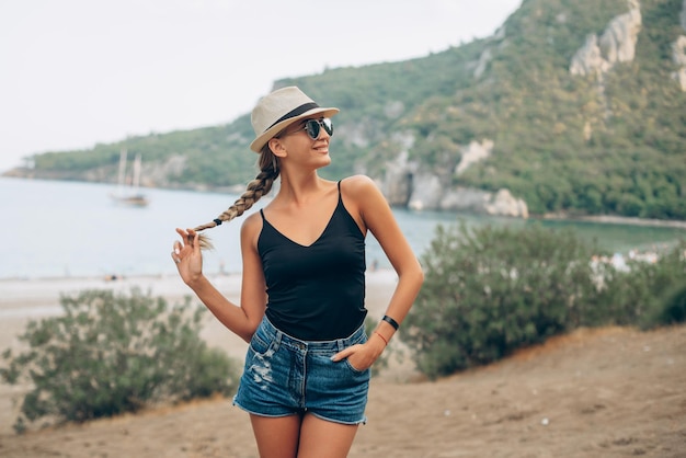 a happy girl at the mountain and at the sea