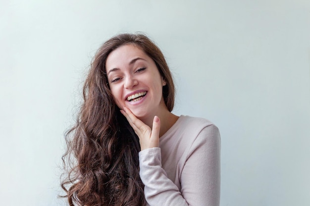 Happy girl smiling beauty portrait young happy positive laughing brunette woman on white background