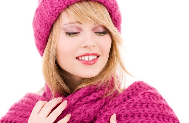 happy girl in winter hat over white