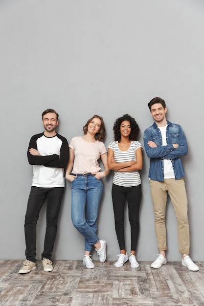 Happy group of friends standing isolated