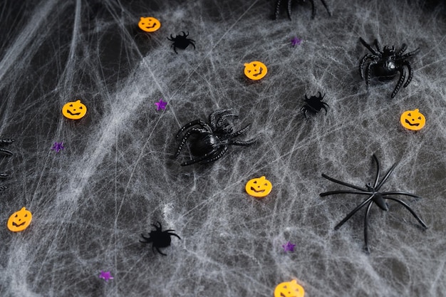 Photo happy halloween banner mockup pumpkins bats and spiders on black background