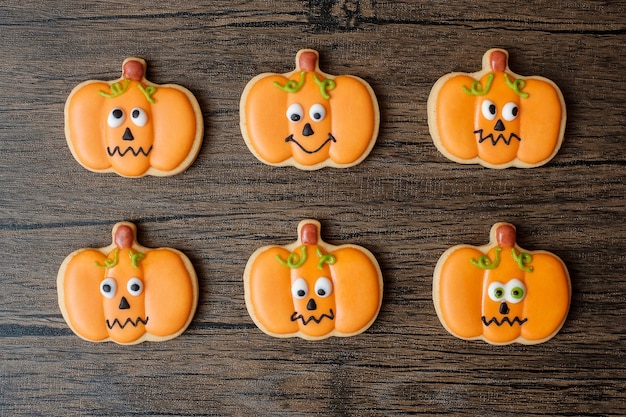 Happy Halloween day with funny Cookies set on wooden table background Trick or Threat Hello October fall autumn Festive party and holiday concept