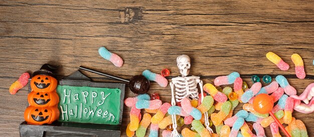 Happy Halloween day with ghost candies, pumpkin,  bowl and decorative. Trick or Threat, Hello October, fall autumn, Festive, party and holiday concept