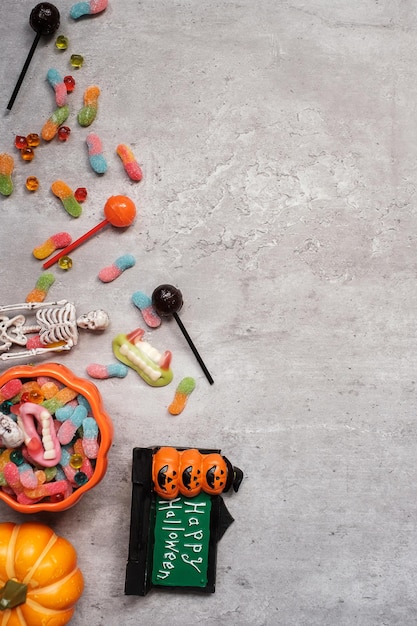 Happy Halloween day with ghost candies pumpkin bowl and decorative Trick or Threat Hello October fall autumn Festive party and holiday concept