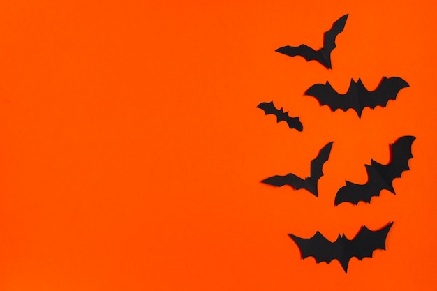 Happy Halloween Paper bats on orange background