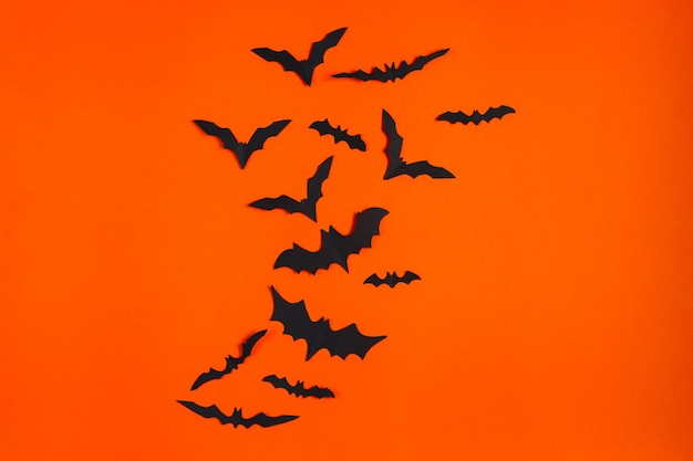 Happy Halloween Paper bats on orange background