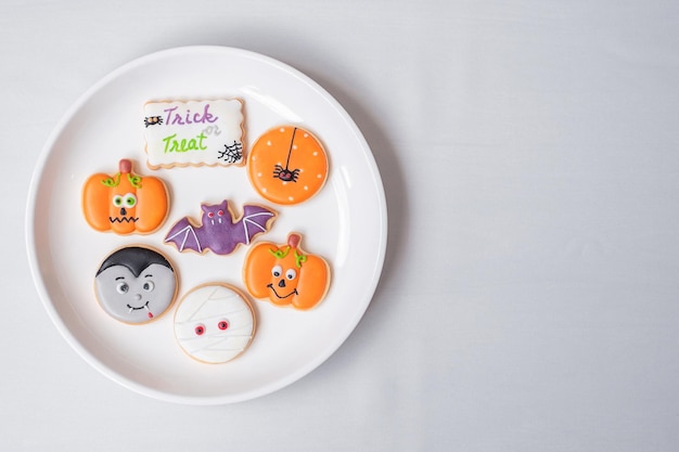 Happy Halloween with funny Cookies Pumpkin scary ghost spooky mummy bat frankenstein dracula and spider Trick or Threat Hello October fall autumn Traditional party and holiday concept