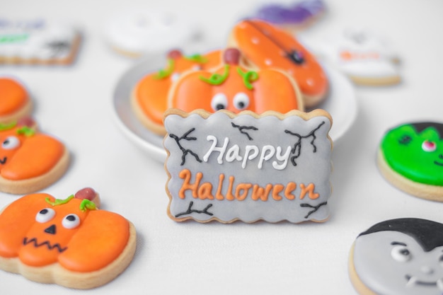 Happy Halloween with funny Cookies Pumpkin scary ghost spooky mummy bat frankenstein dracula and spider Trick or Threat Hello October fall autumn Traditional party and holiday concept