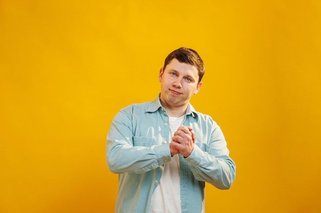 Happy handsome man looking at camera shaking his hands showing that deal is done Safe gesture without touching other person hands in pandemic time