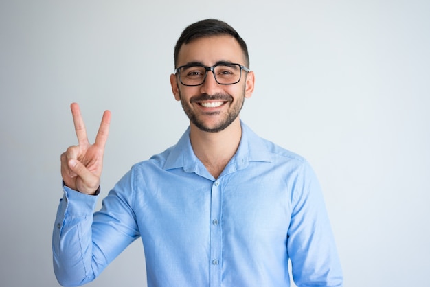 Happy Handsome Man Showing Victory Sign