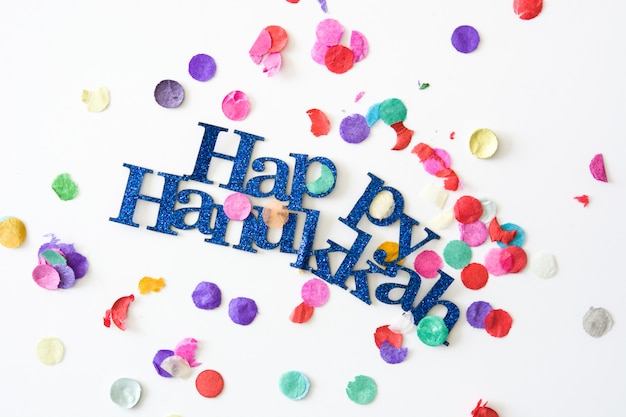 Happy Hanukkah and confetti.