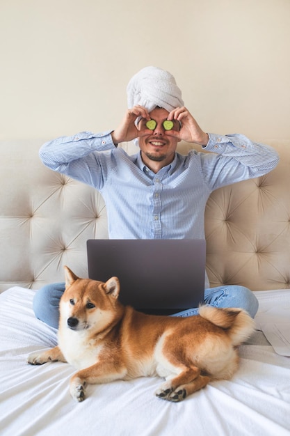 Happy home office developer with his dog