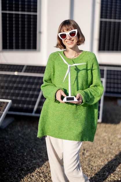 Happy house owner with a solar plant