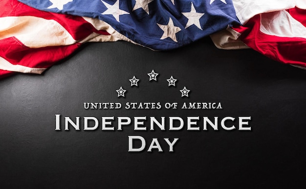 Happy Independence day concept made from American flag and the text on dark wooden background