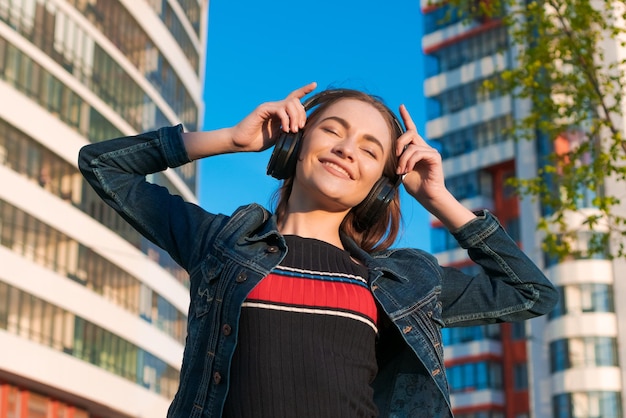 Happy joyful fashion trendy trendy hipster female student young woman enjoys