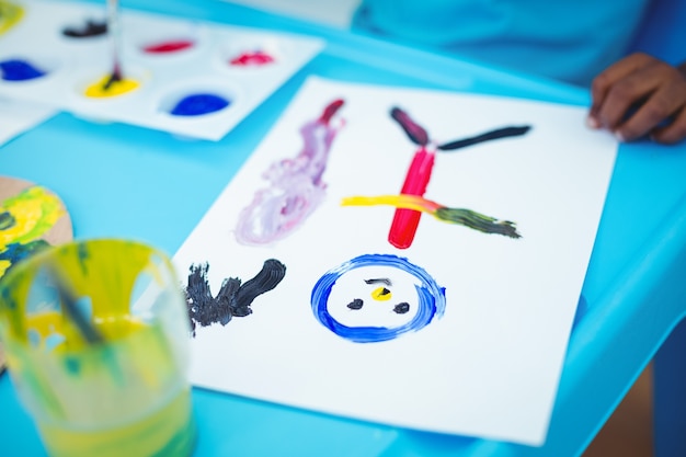 Happy kid enjoying arts and crafts painting