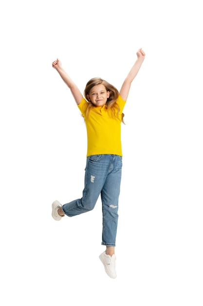 Happy kid girl isolated on white studio background Looks happy cheerful sincere Copyspace Childhood education emotions concept