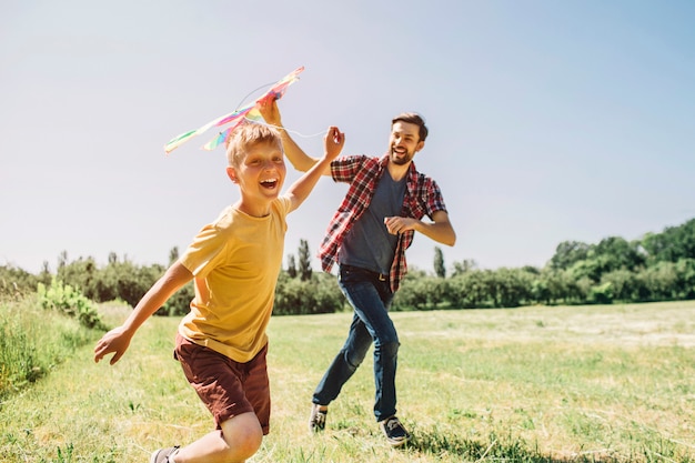 Happy kid is running on field