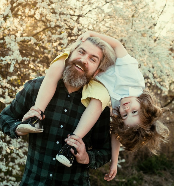 Happy kid shoulder ride on dad fathers day father son relationships friendly family relationships