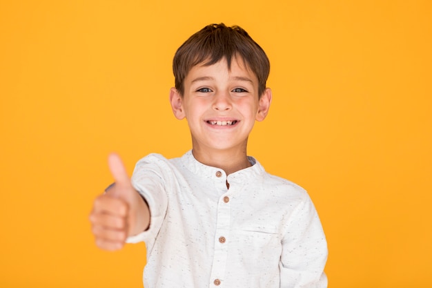 Happy kid showing the like sign