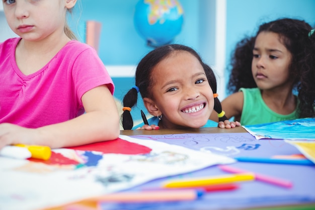 Happy kids all drawing pictures