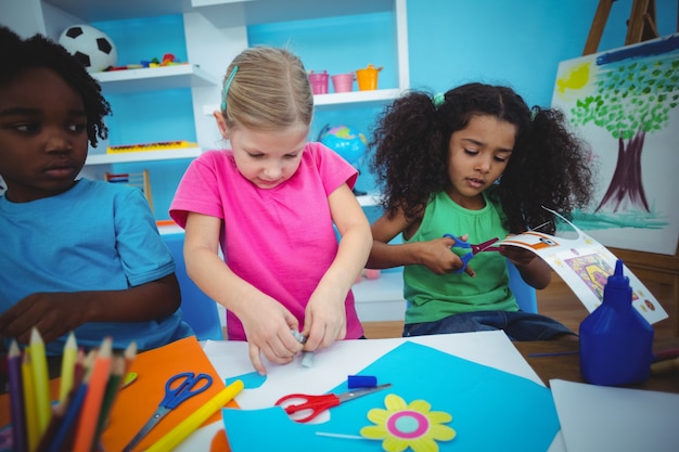 Happy kids doing arts and crafts together