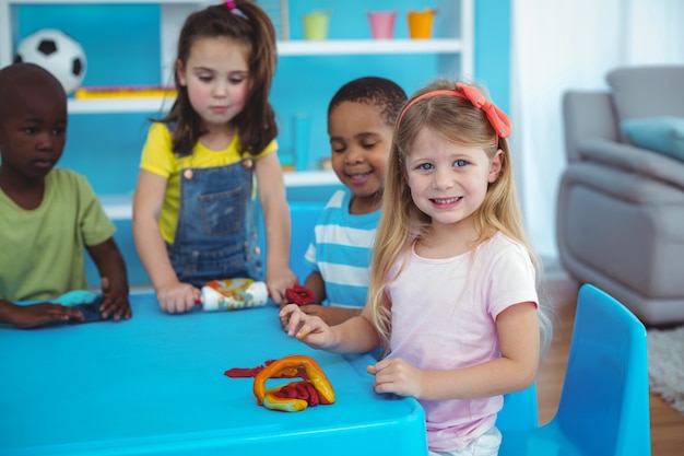 Happy kids enjoying arts and crafts together