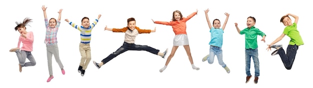 happy kids jumping in air over white background