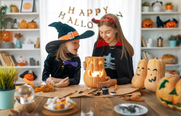 Happy kids preparing for Halloween