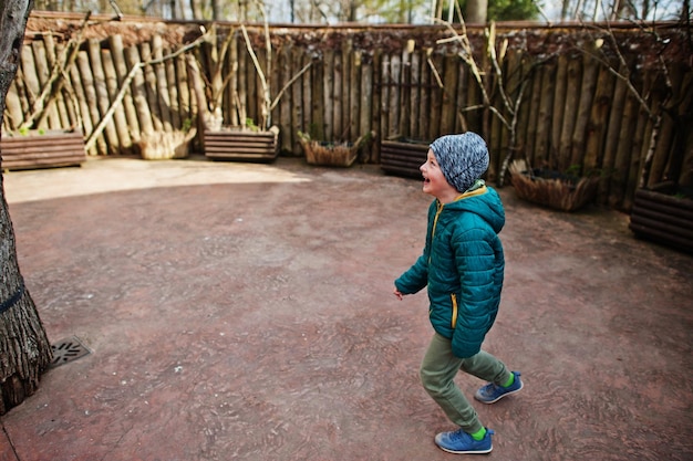 Happy laughing boy at bird zoo