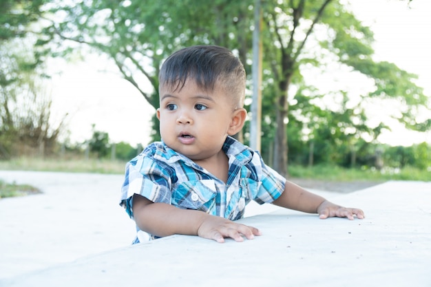 Happy little baby boy play at the park