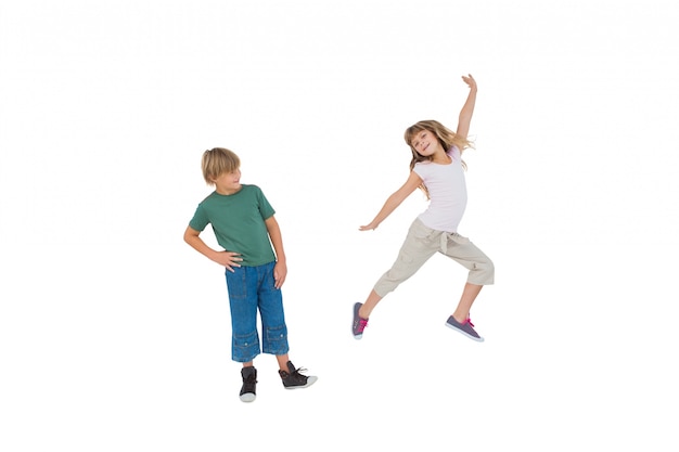 Happy little boy and girl jumping