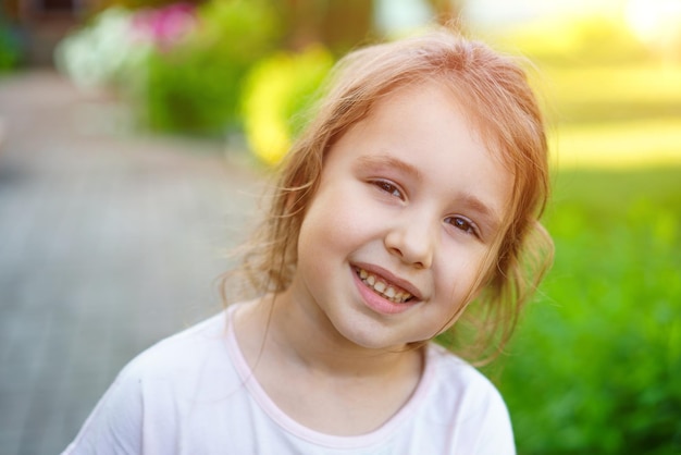 Happy little caucasian baby girls showing front teeth with big smile